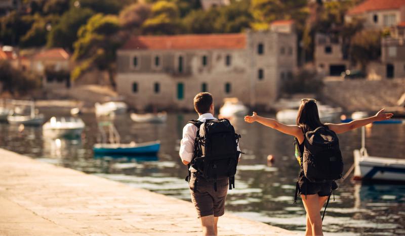 Couple walking along waterfront during incentive trip